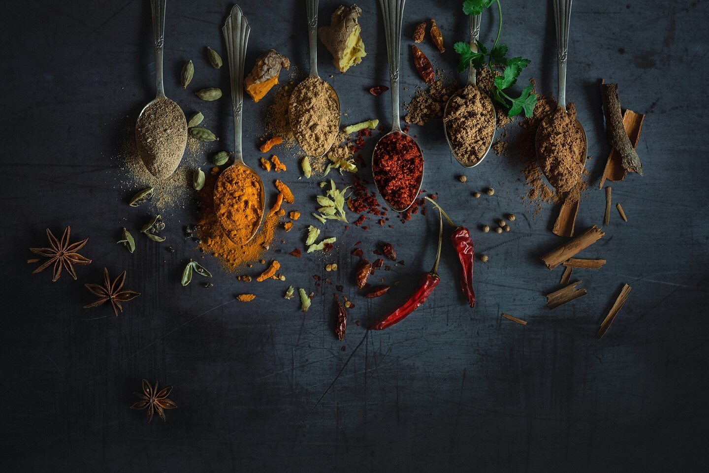 whole and ground spices on spoons for Mandira's Kitchen near Guildford Surrey photographer