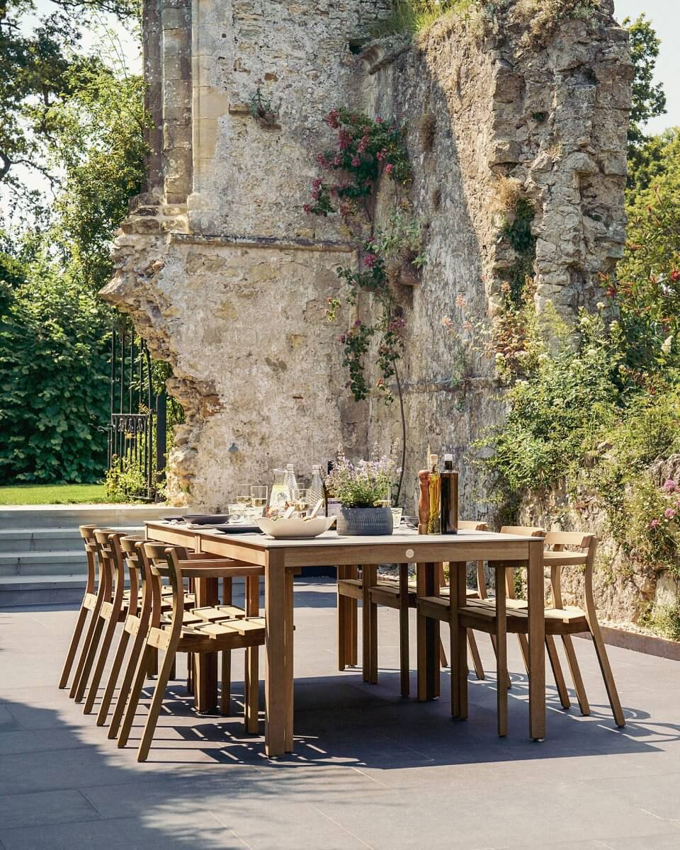 Levity table dining set by Gaze Burvill set in historic abbey ruins and laid for outdoor dining