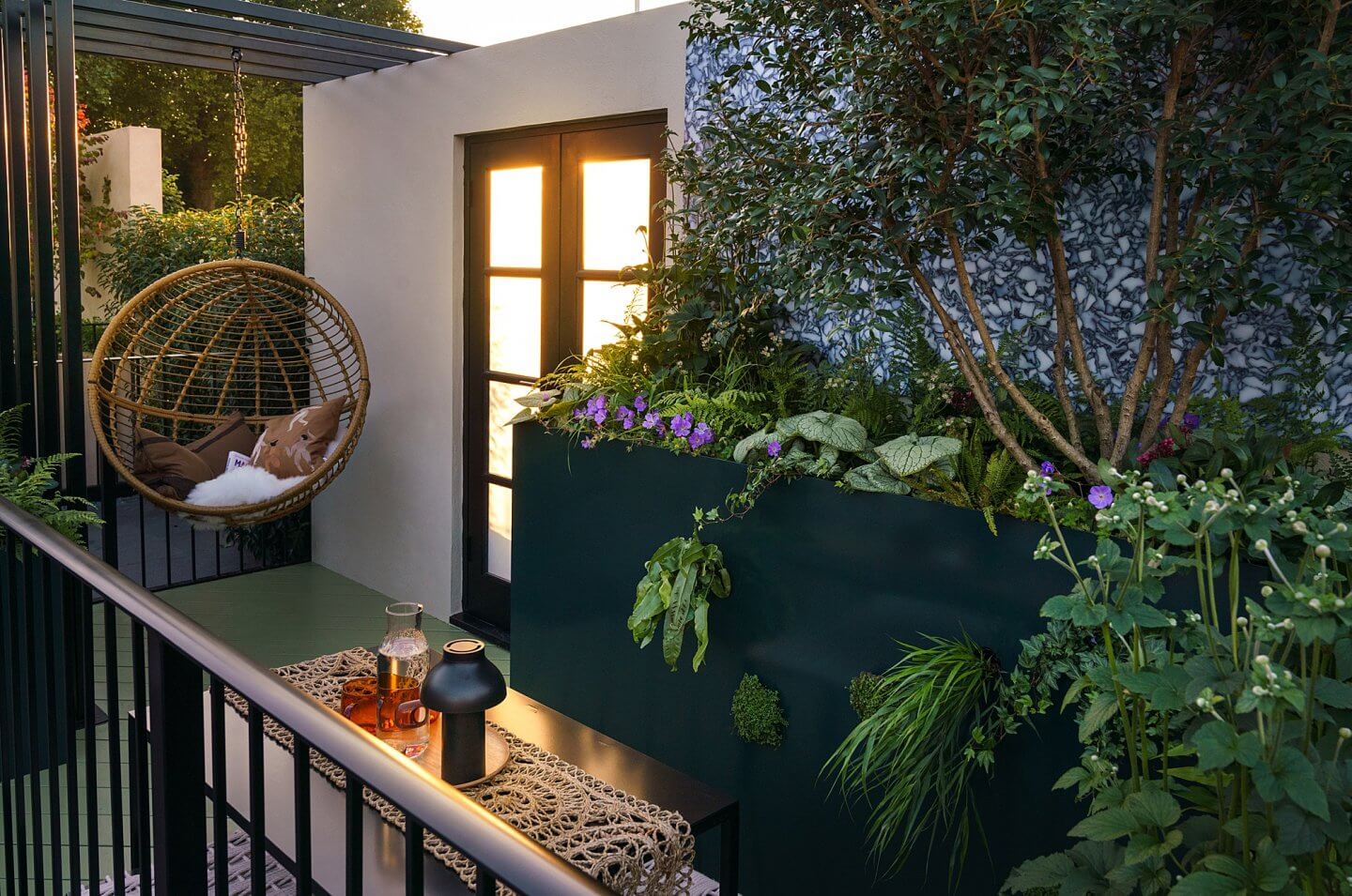 balcony garden with hanging chair at sunset Chelsea Flower Show