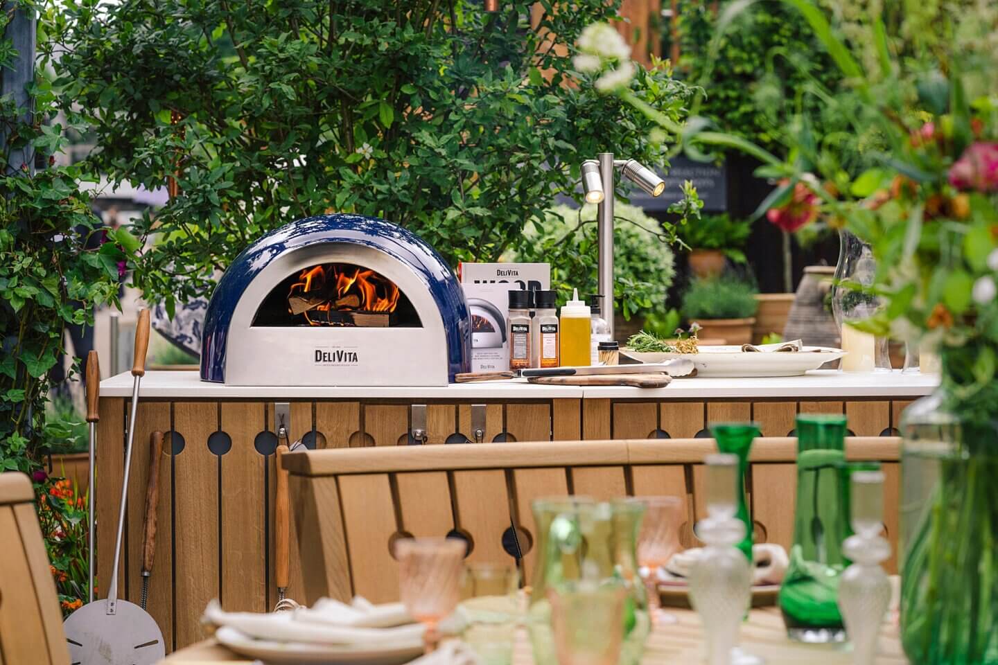 Delivita wood-fired pizza oven in an outdoor kitchen by Gaze Burvill