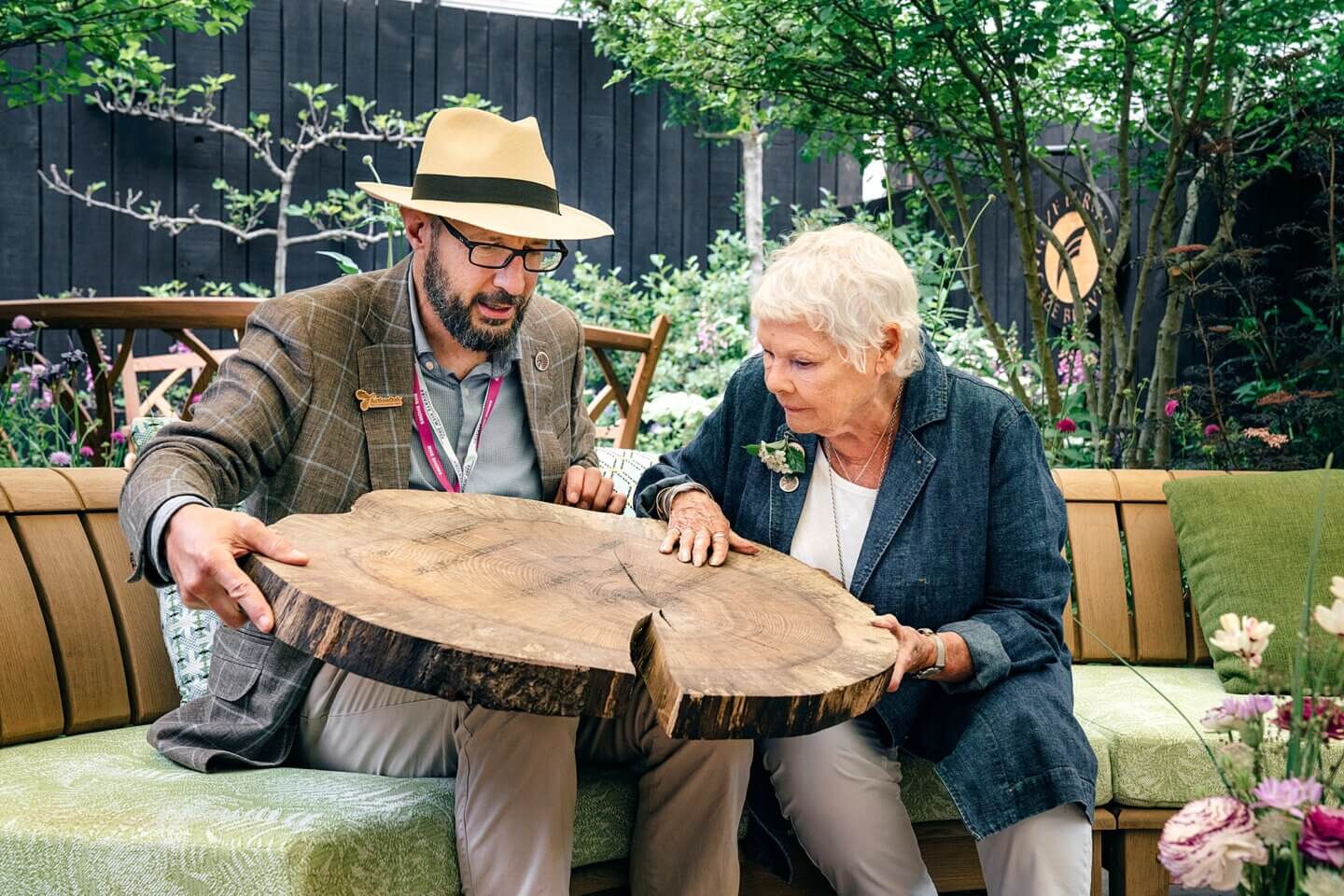 examining the dates engraved in oak for Dame Judi Dench