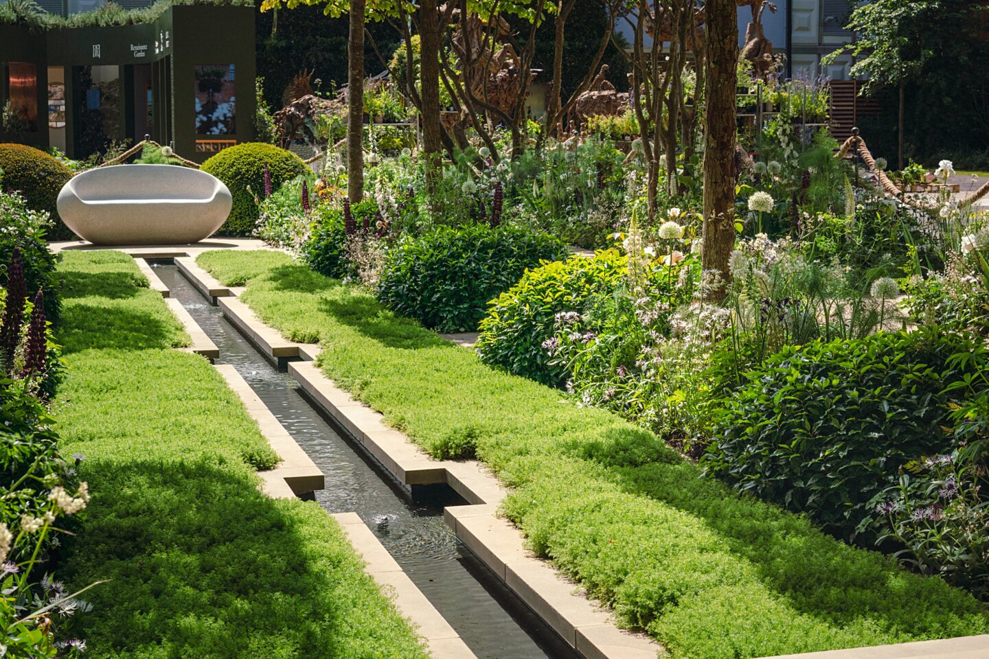 The Perennial Garden with rill and chamomile lawn lined with white and green planting