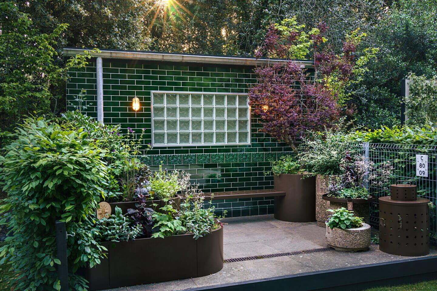 Bausager and Bouquet 2023 Chelsea container garden, 'The Platform Garden' with planting in pots and green tiles
