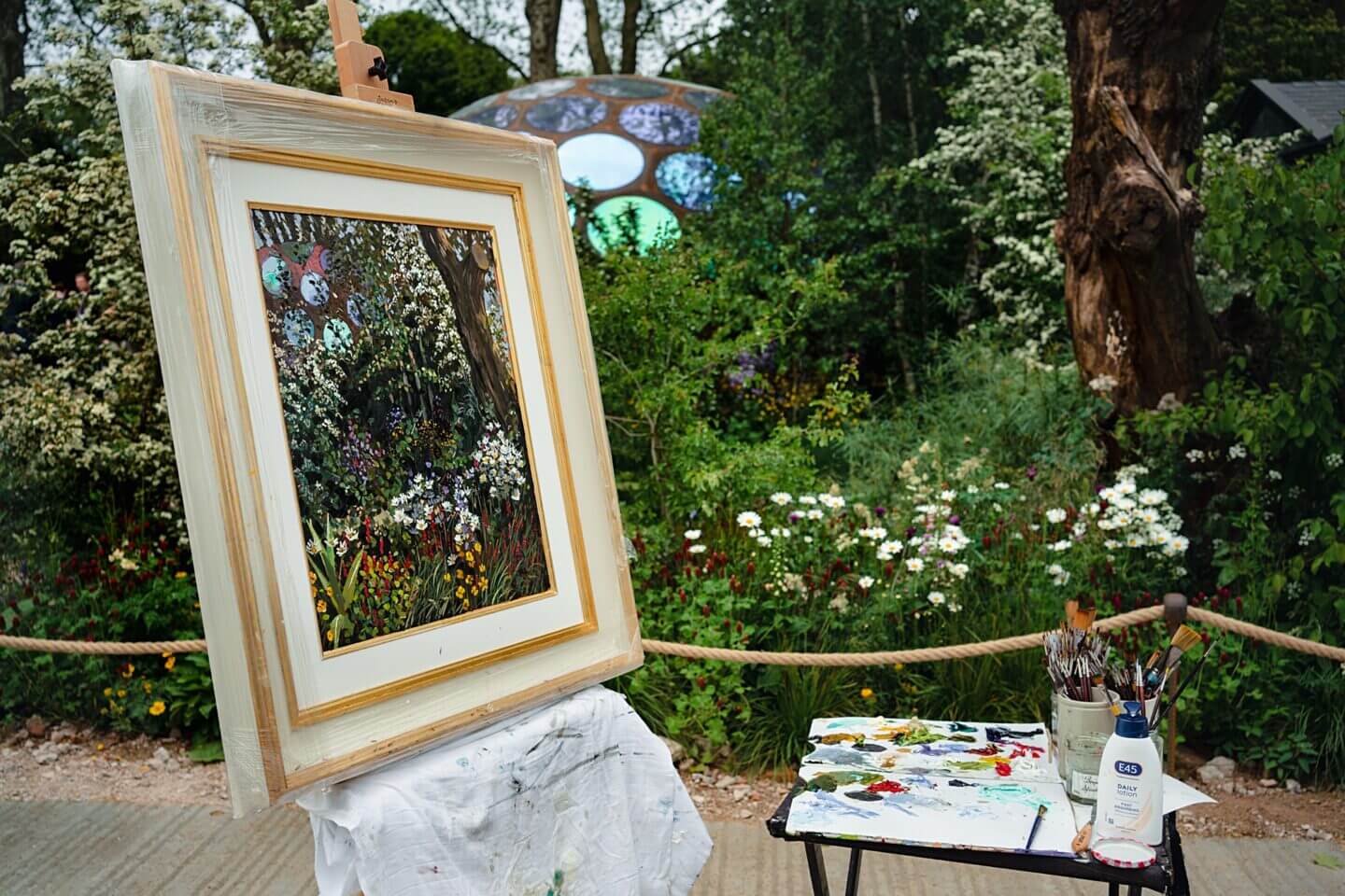 Artist's canvas capturing a show garden at the Chelsea Flower Show