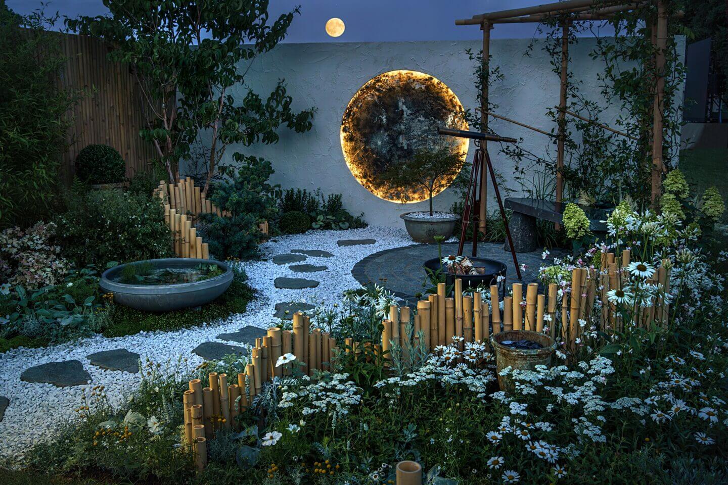 Full moon in July over a lunar themed garden at RHS Hampton Court